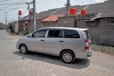 A family van taxi parked near a residential area in Kuwait.