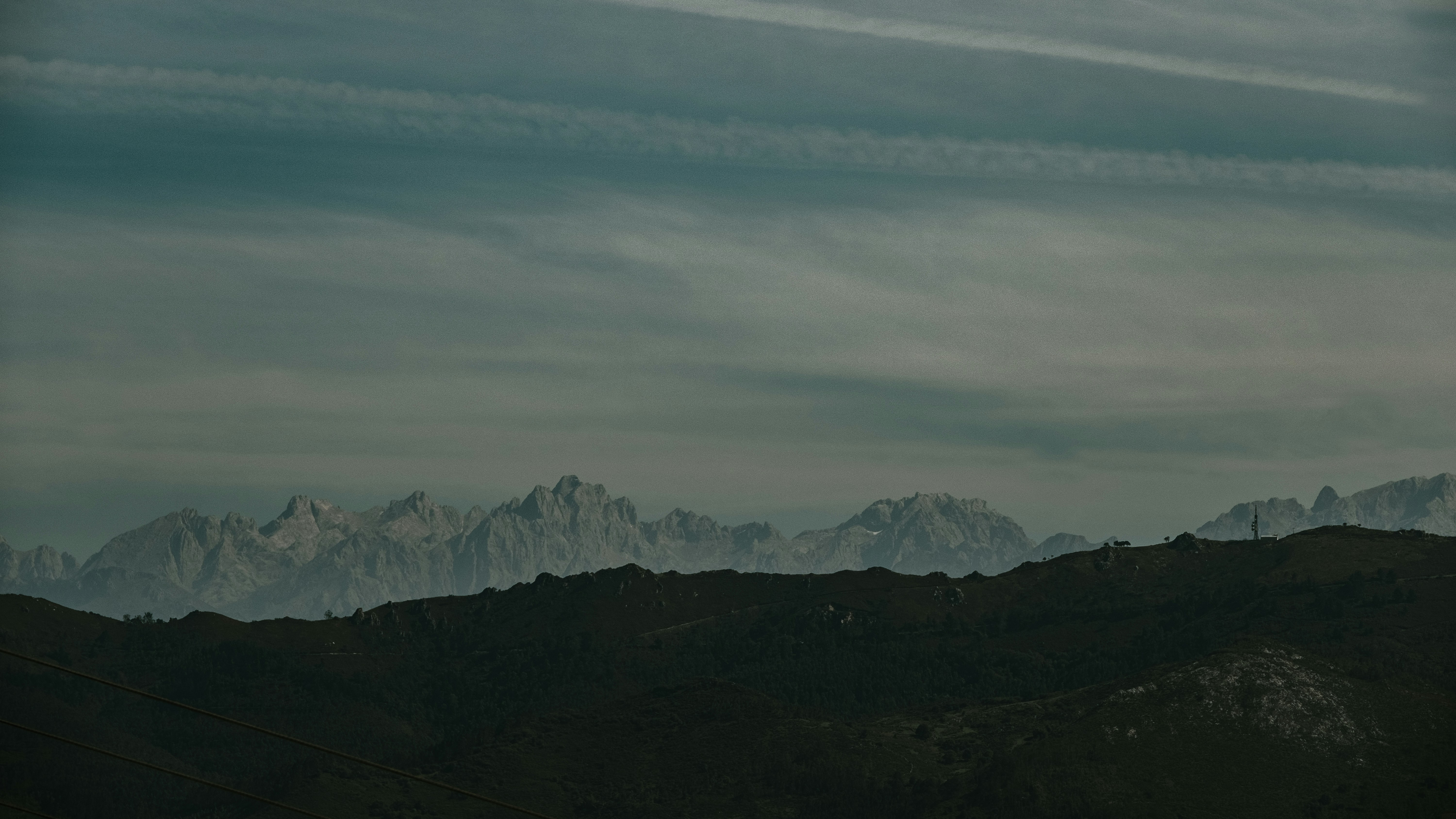 green mountains under white clouds during daytime