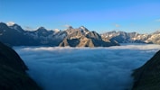 snow covered mountains under blue sky during daytime