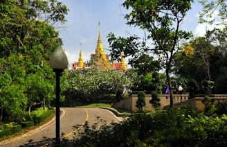 A scenic highway stretching towards a historic temple in Madhya Pradesh.