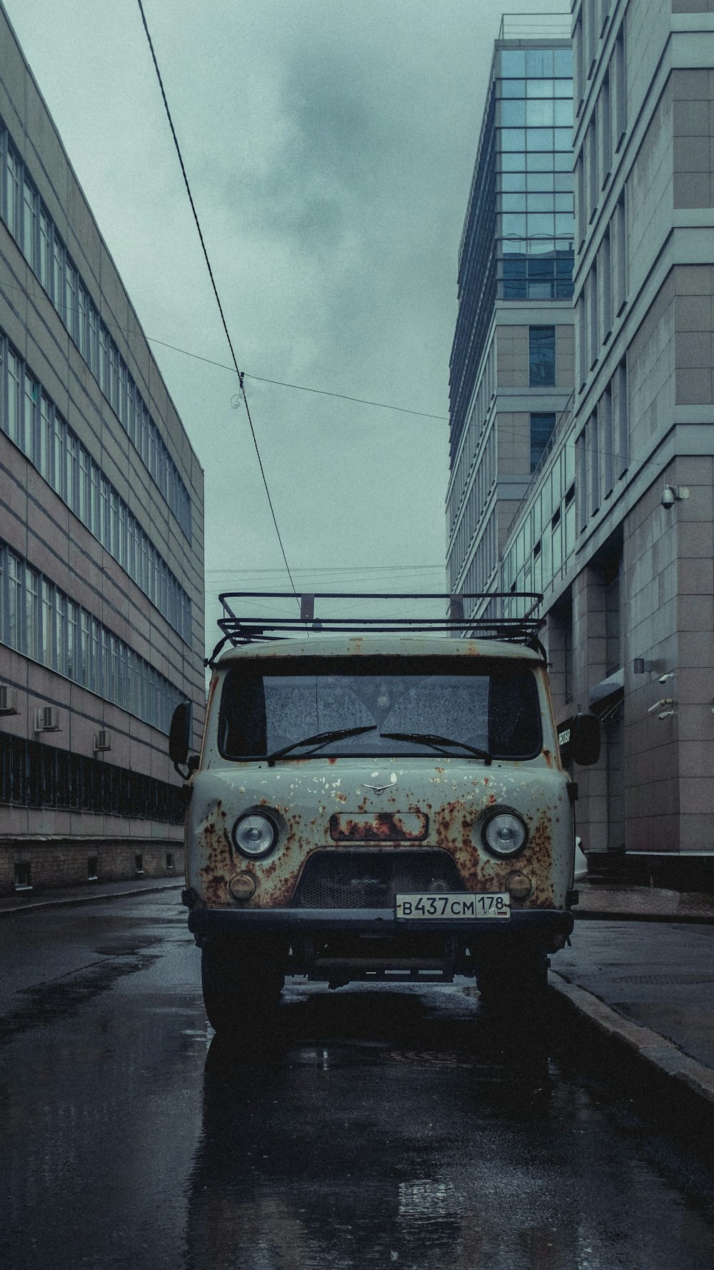 yellow and white van on road near building during daytime