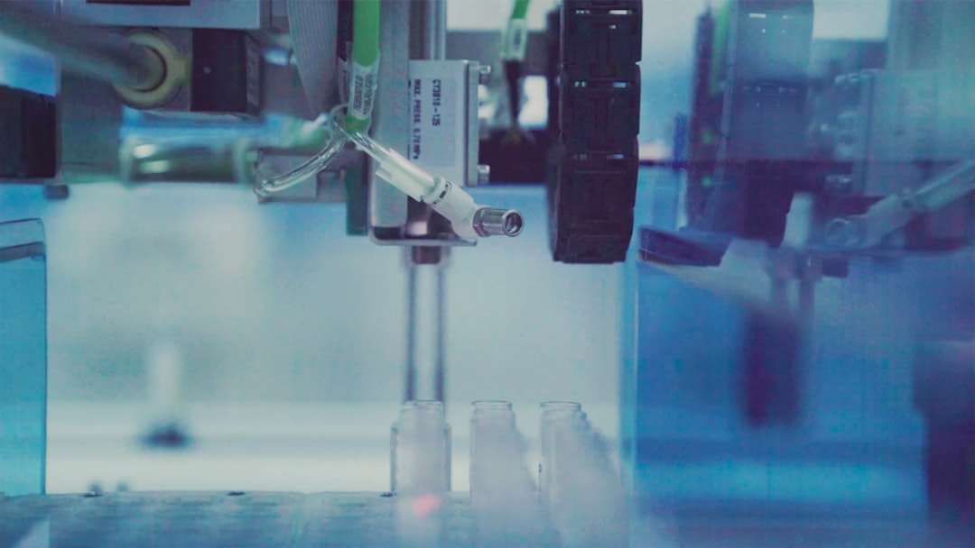 black and gray metal tool, Laboratory. Automated process where samples are being analyzed from transporttubes in large Dutch lab.
