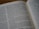 An open book with text displayed, featuring two visible pages. The text is printed in a serif font, with clear delineations between paragraphs and a focus on readability. The page numbers are located at the top corners of the pages.