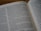 An open book with text displayed, featuring two visible pages. The text is printed in a serif font, with clear delineations between paragraphs and a focus on readability. The page numbers are located at the top corners of the pages.