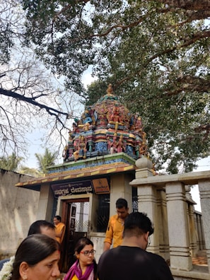 A peaceful village temple decorated with colorful flowers during a festival.