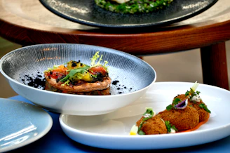 Close-up of gourmet catering dishes artfully presented on elegant platters.