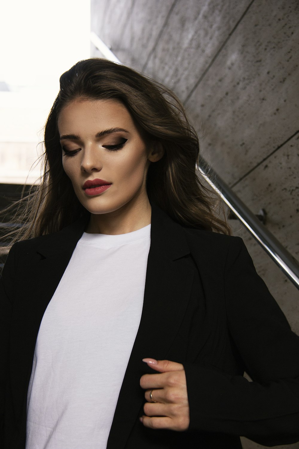 woman in black blazer and white shirt