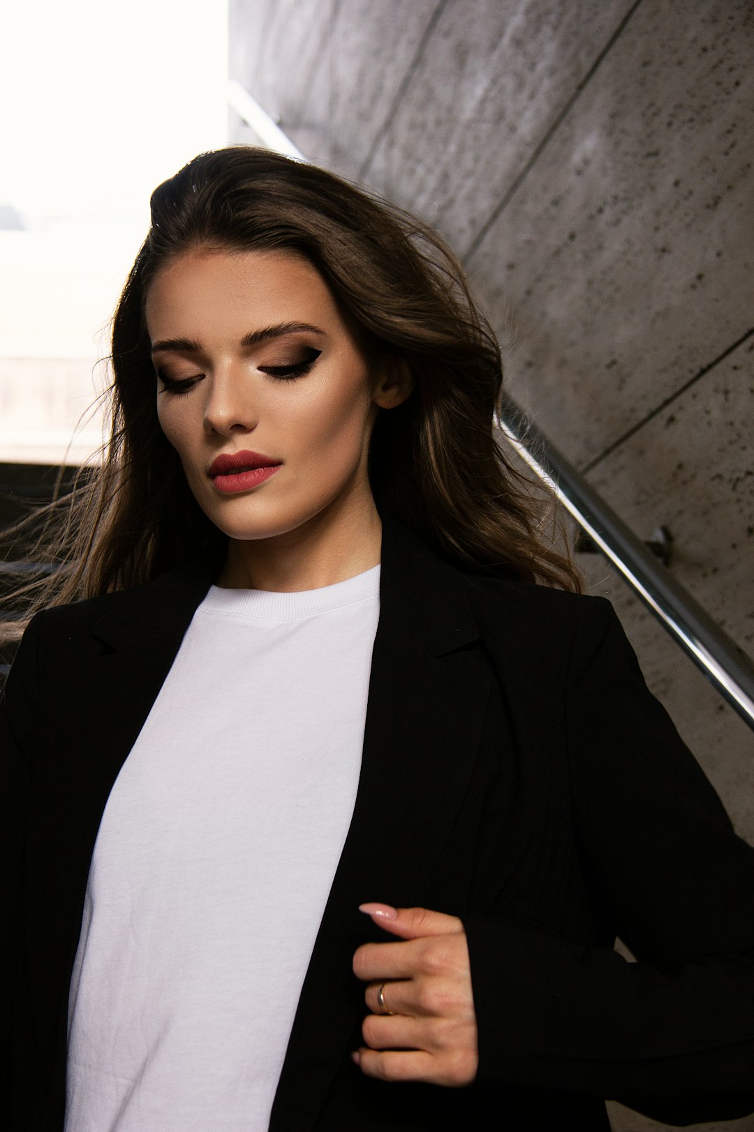 woman in black blazer and white shirt