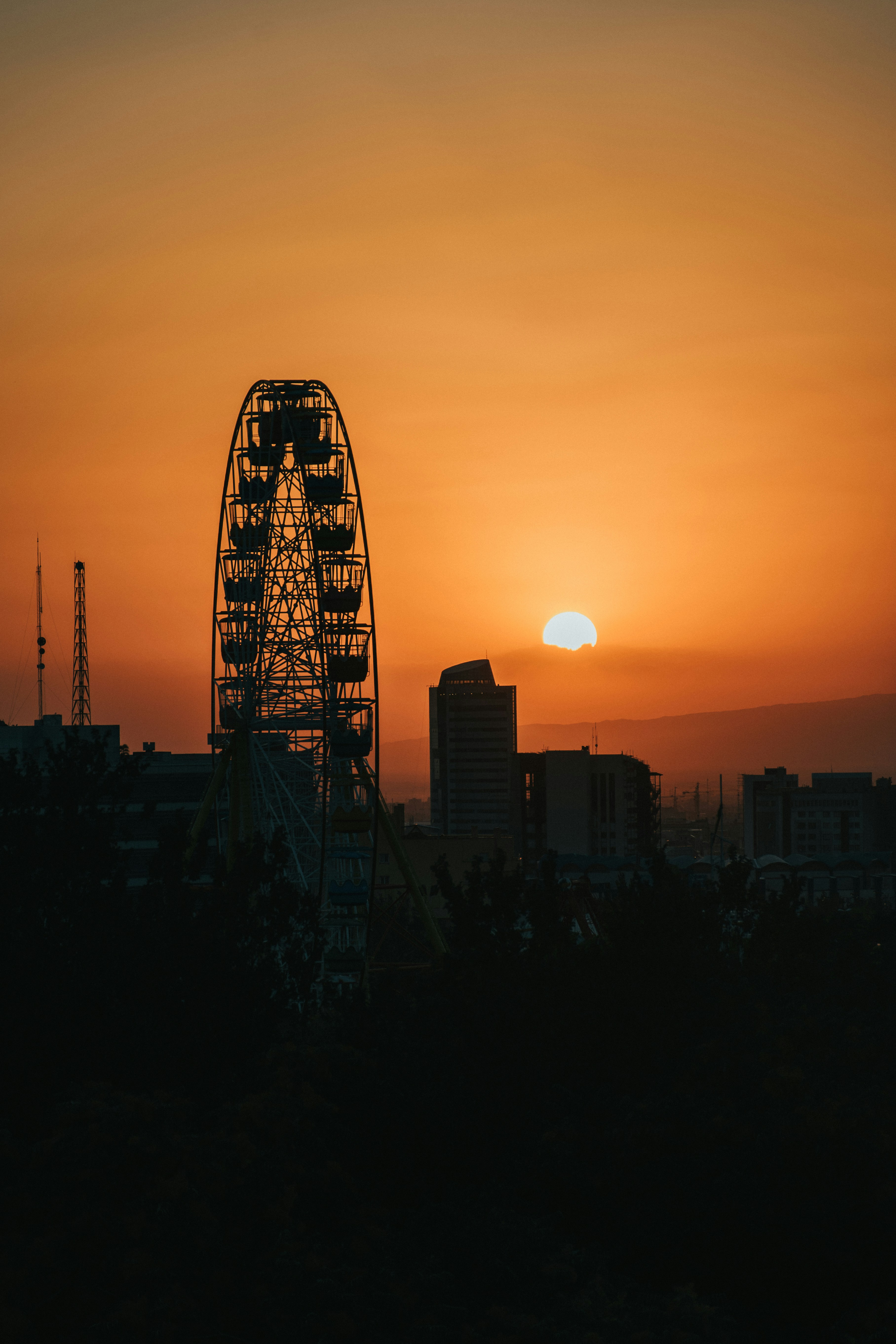 silhouette of city buildings during sunset