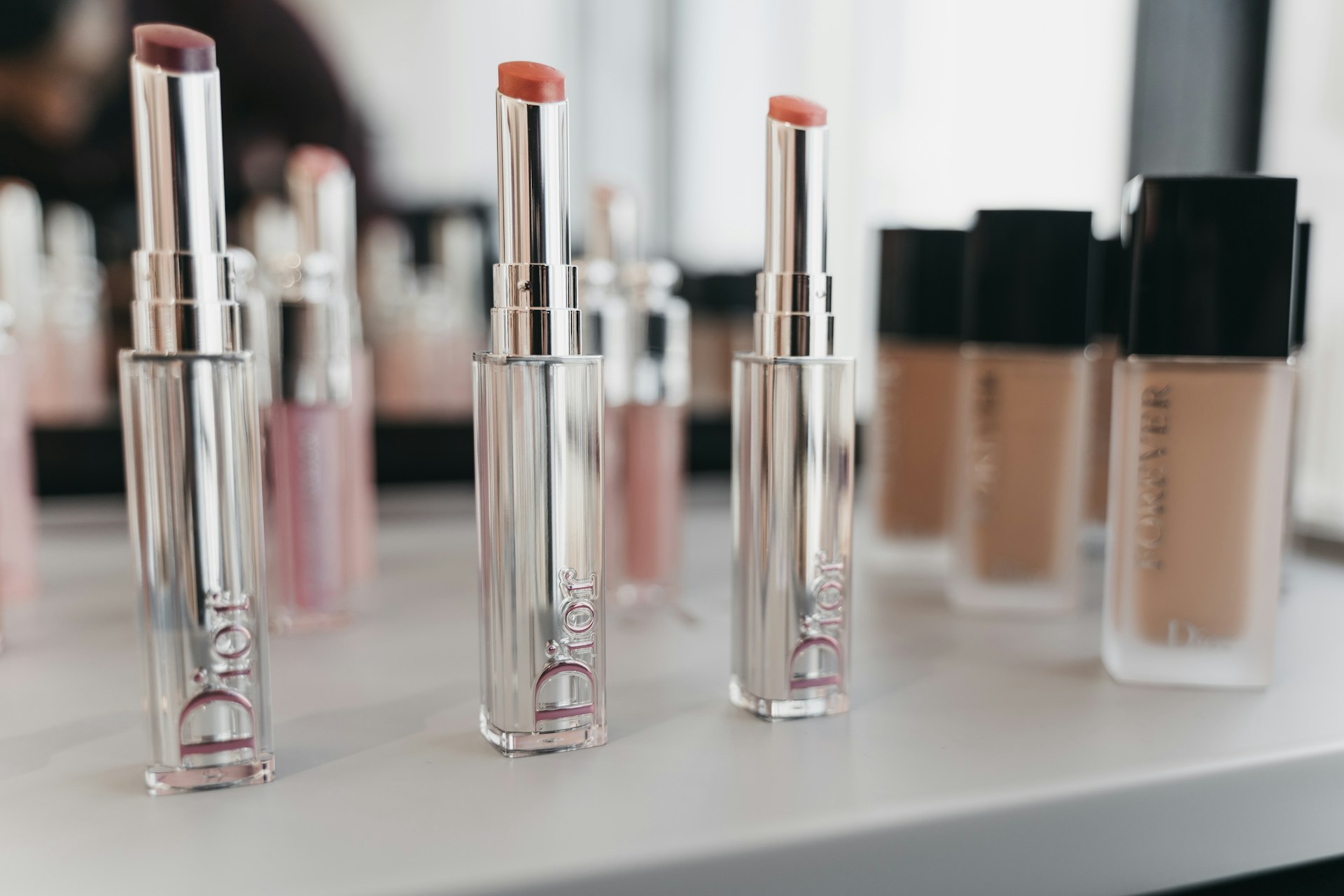 pink and silver nail polish bottles