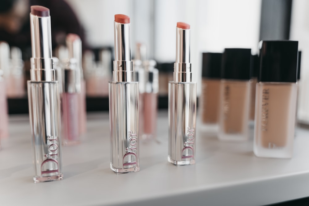 pink and silver nail polish bottles