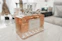 clear glass perfume bottle on white table