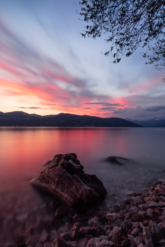 body of water near mountain during sunset in Ispra Italy