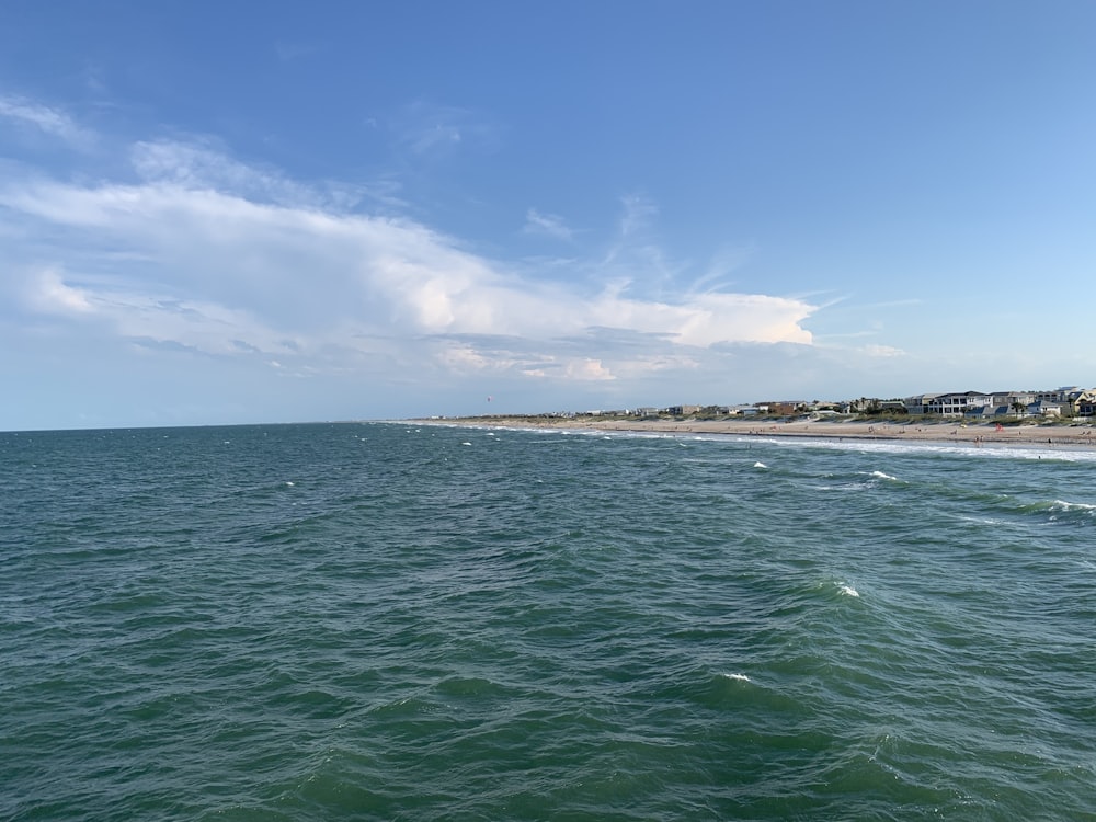 body of water under blue sky during daytime