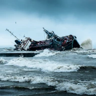 black and brown ship on sea during daytime