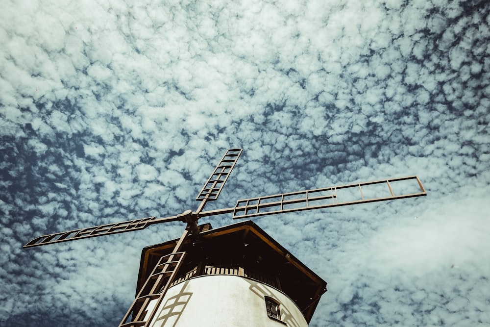 black and white cable car under white clouds and blue sky during daytime