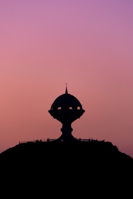 silhouette of dome building during sunset