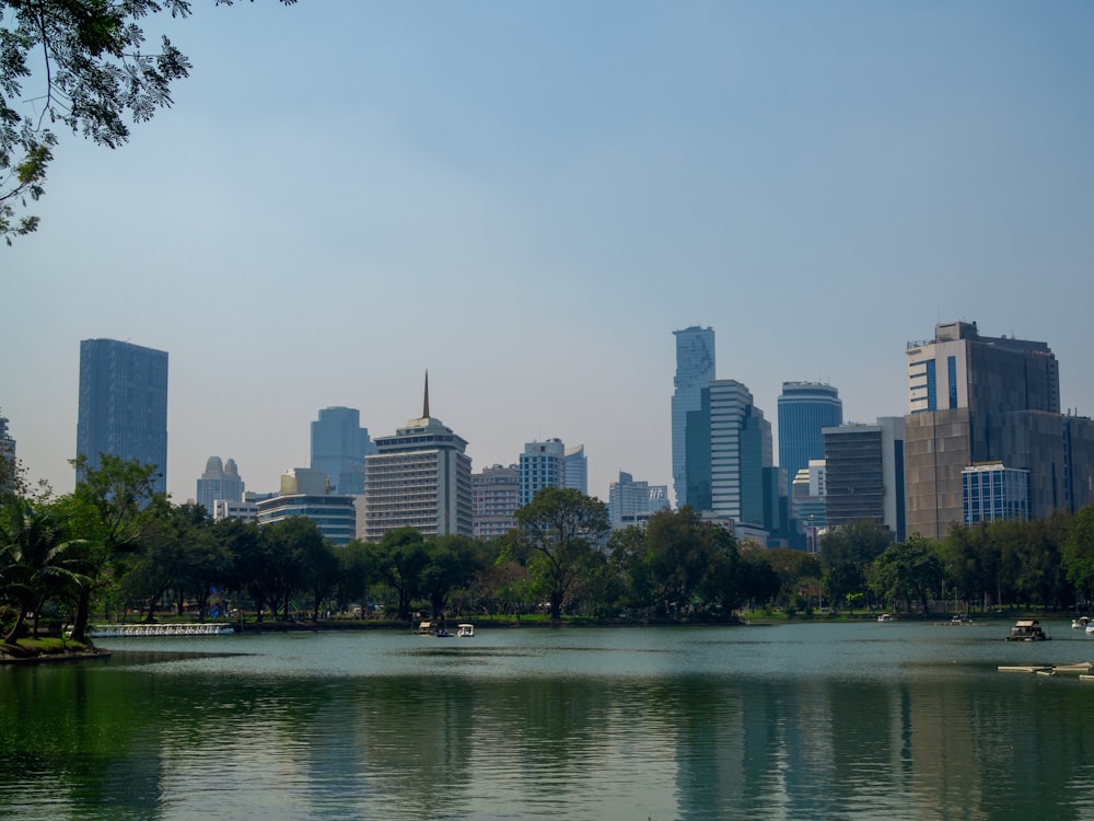 city skyline across body of water during daytime