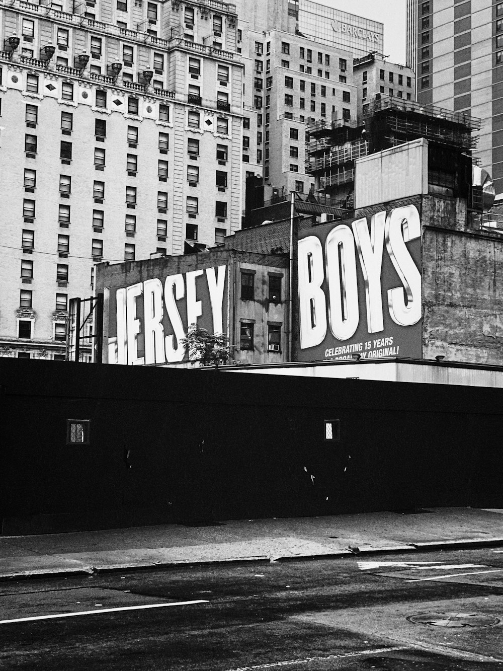 grayscale photo of city buildings