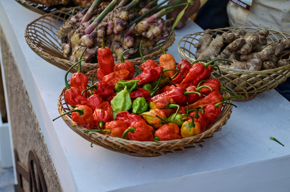 red chili on brown woven basket