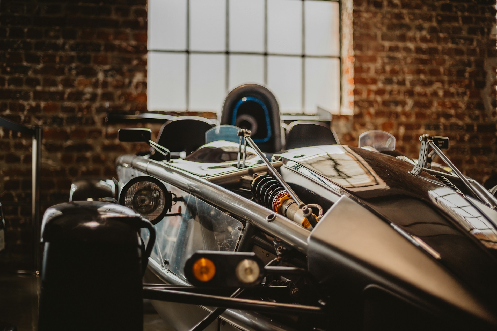 black and brown leather padded tub sofa