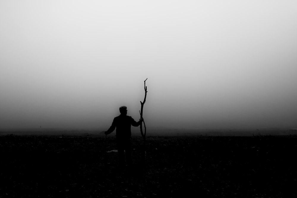 silhouette of person standing on ground