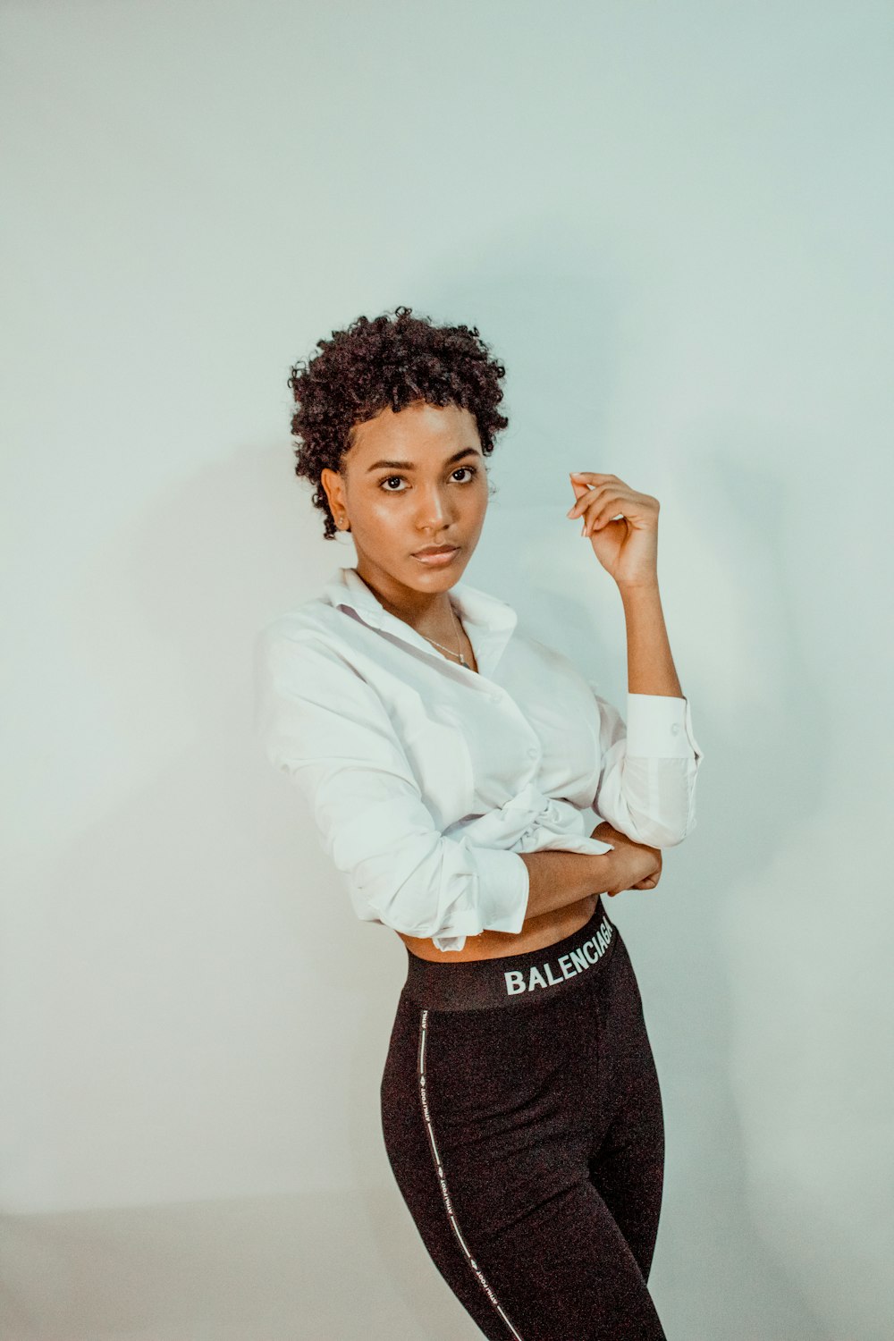 woman in white dress shirt and black skirt