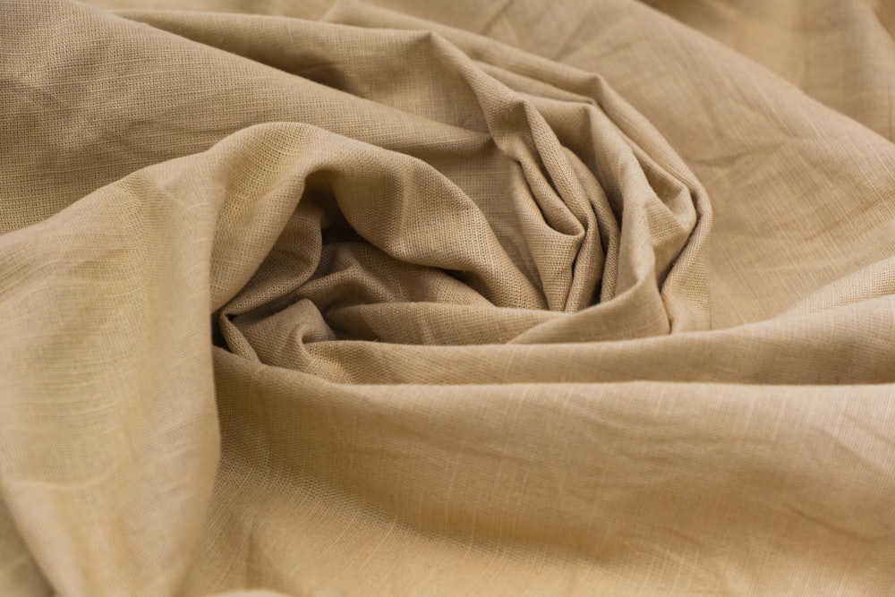 gray textile on brown wooden table