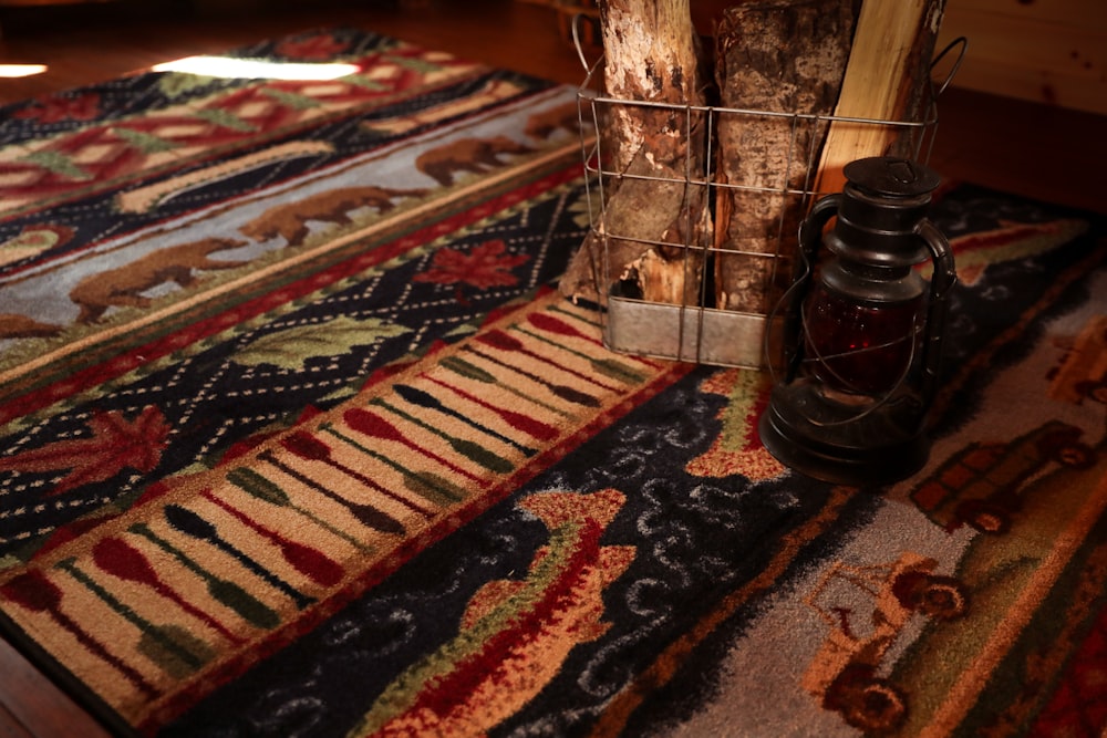 brown wooden table on red and brown area rug