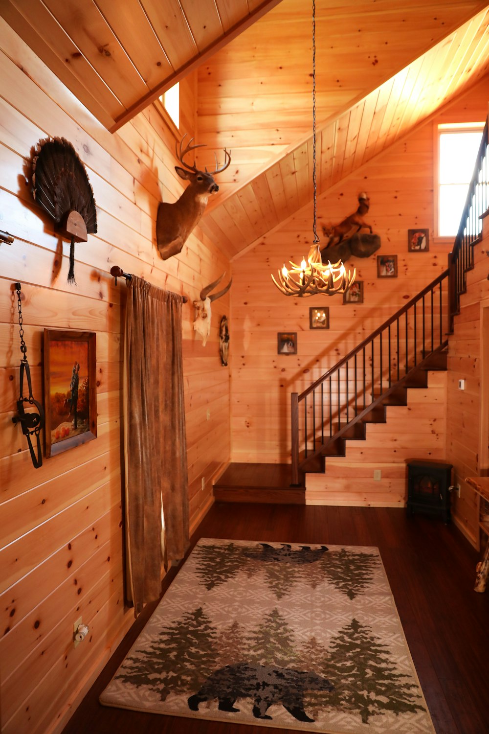 brown wooden staircase with white wooden railings