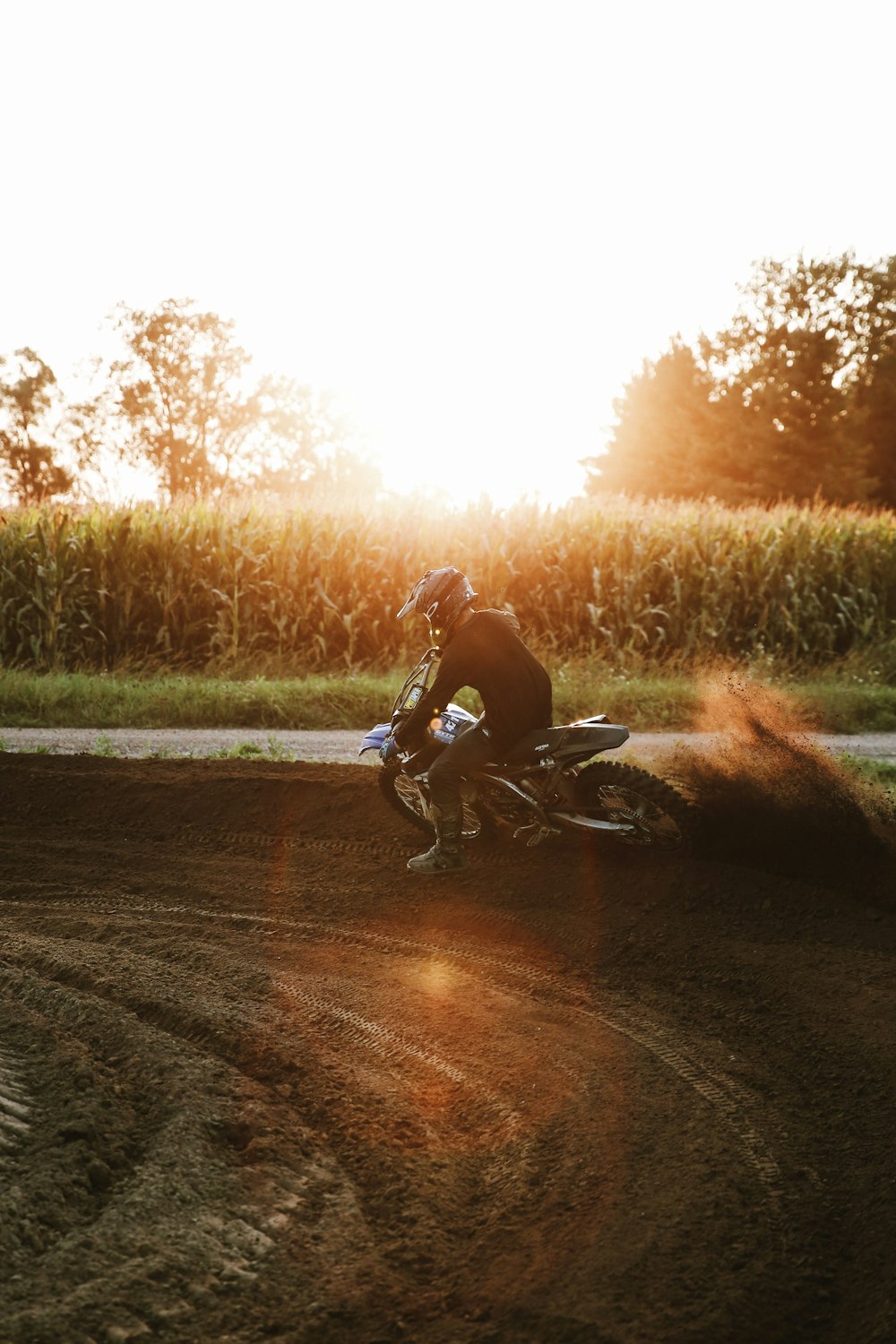 man riding motorcycle on road during daytime