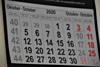 black and white calendar on white wall