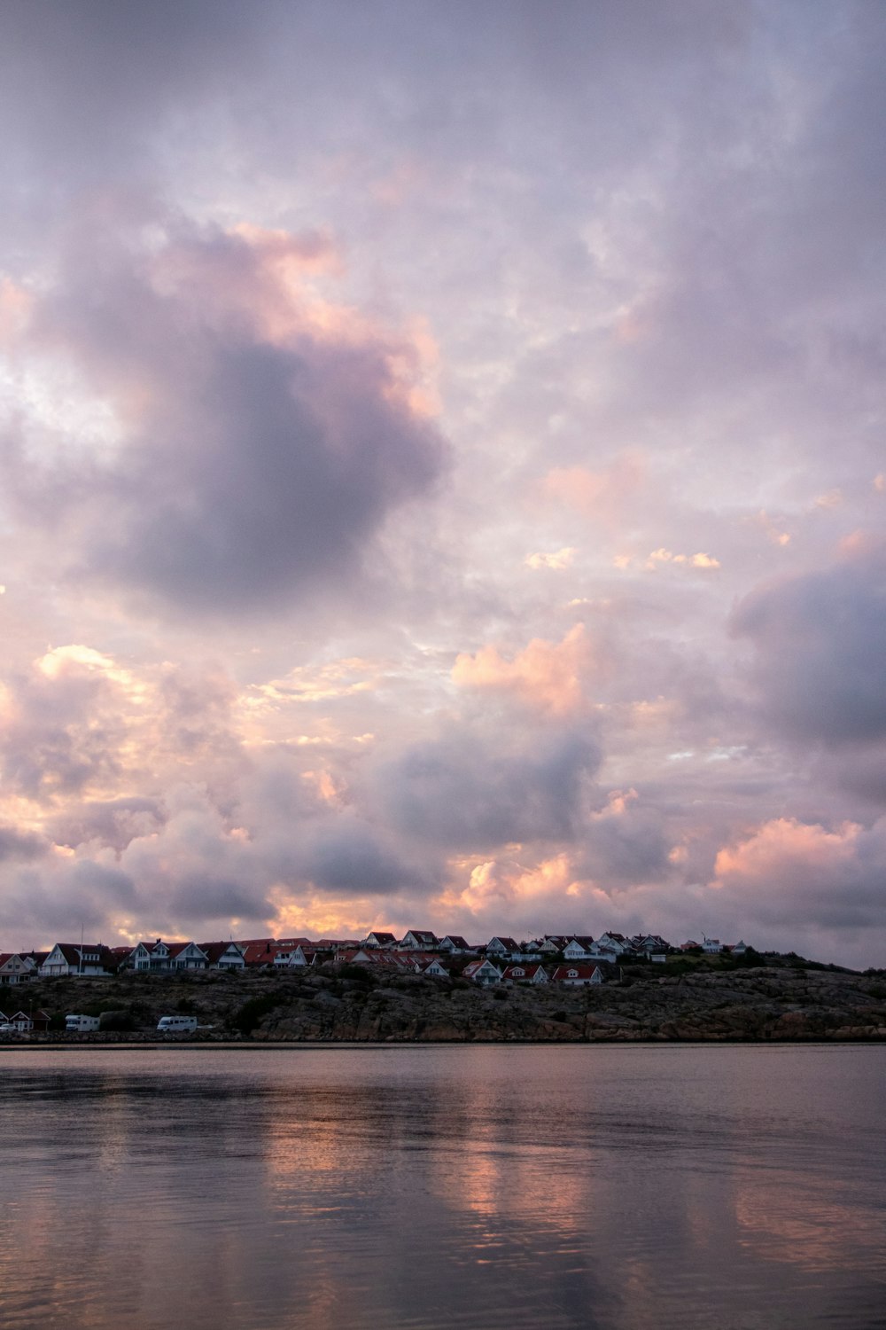 body of water under cloudy sky during daytime