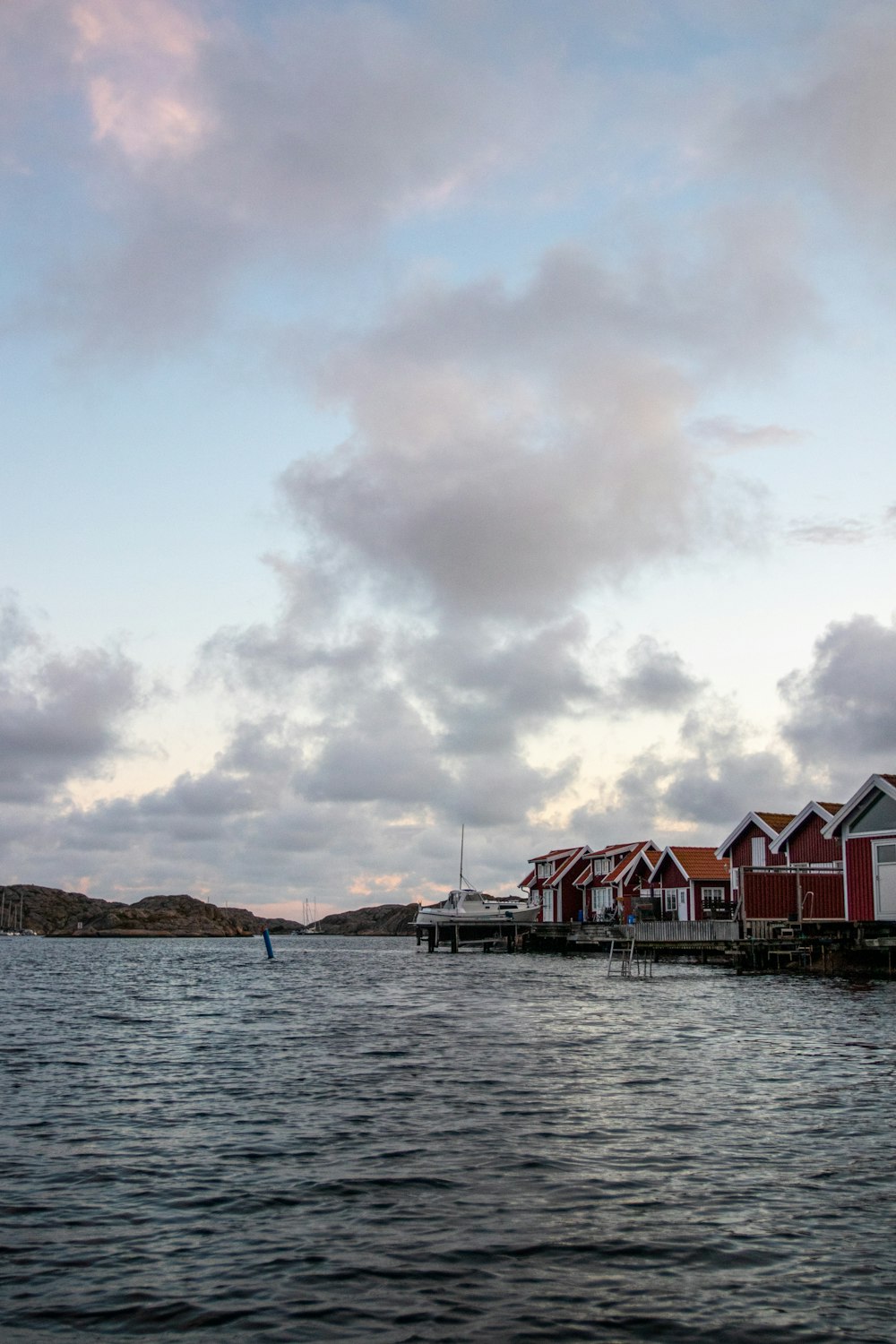 red and white house on the sea shore