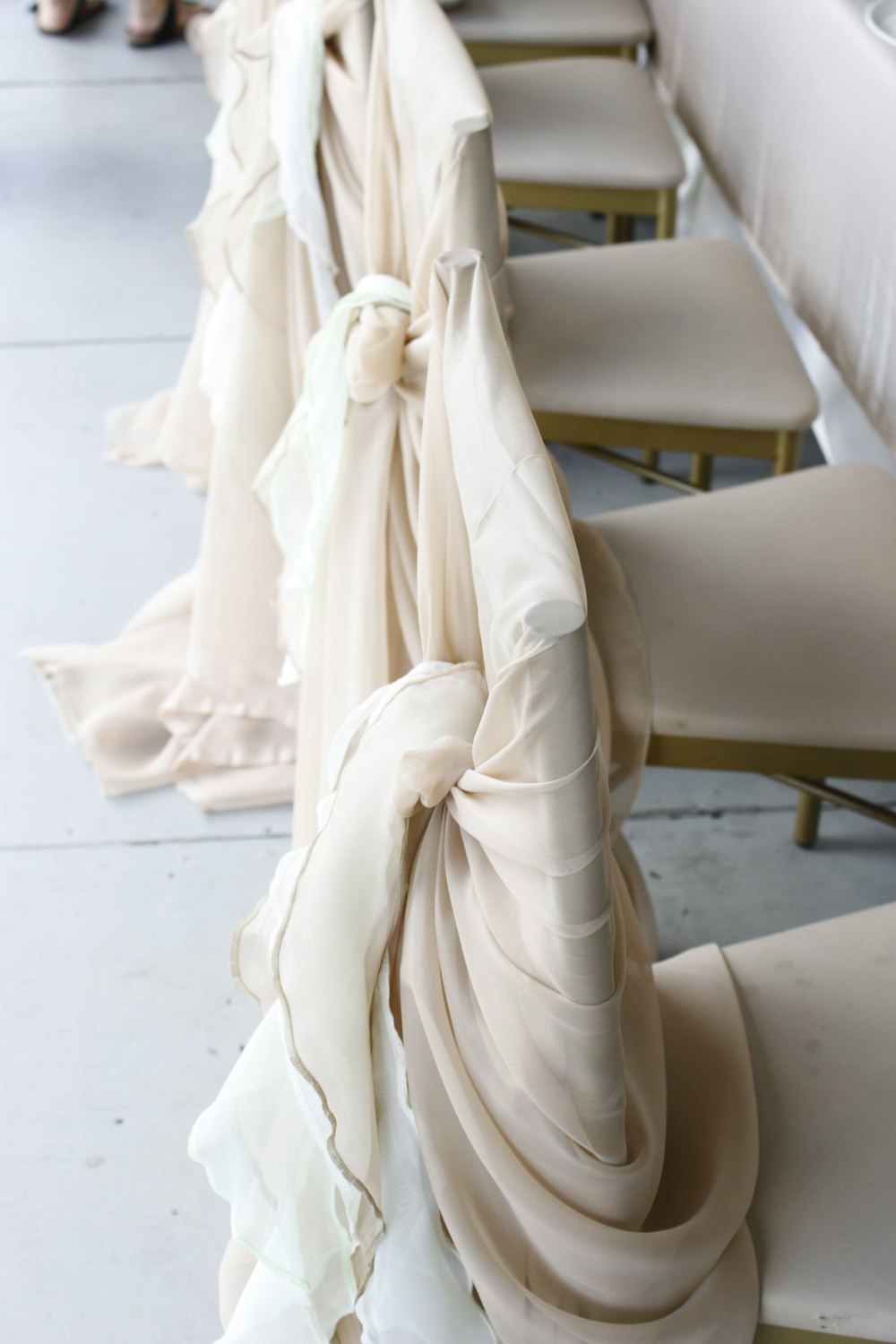 white textile on white table