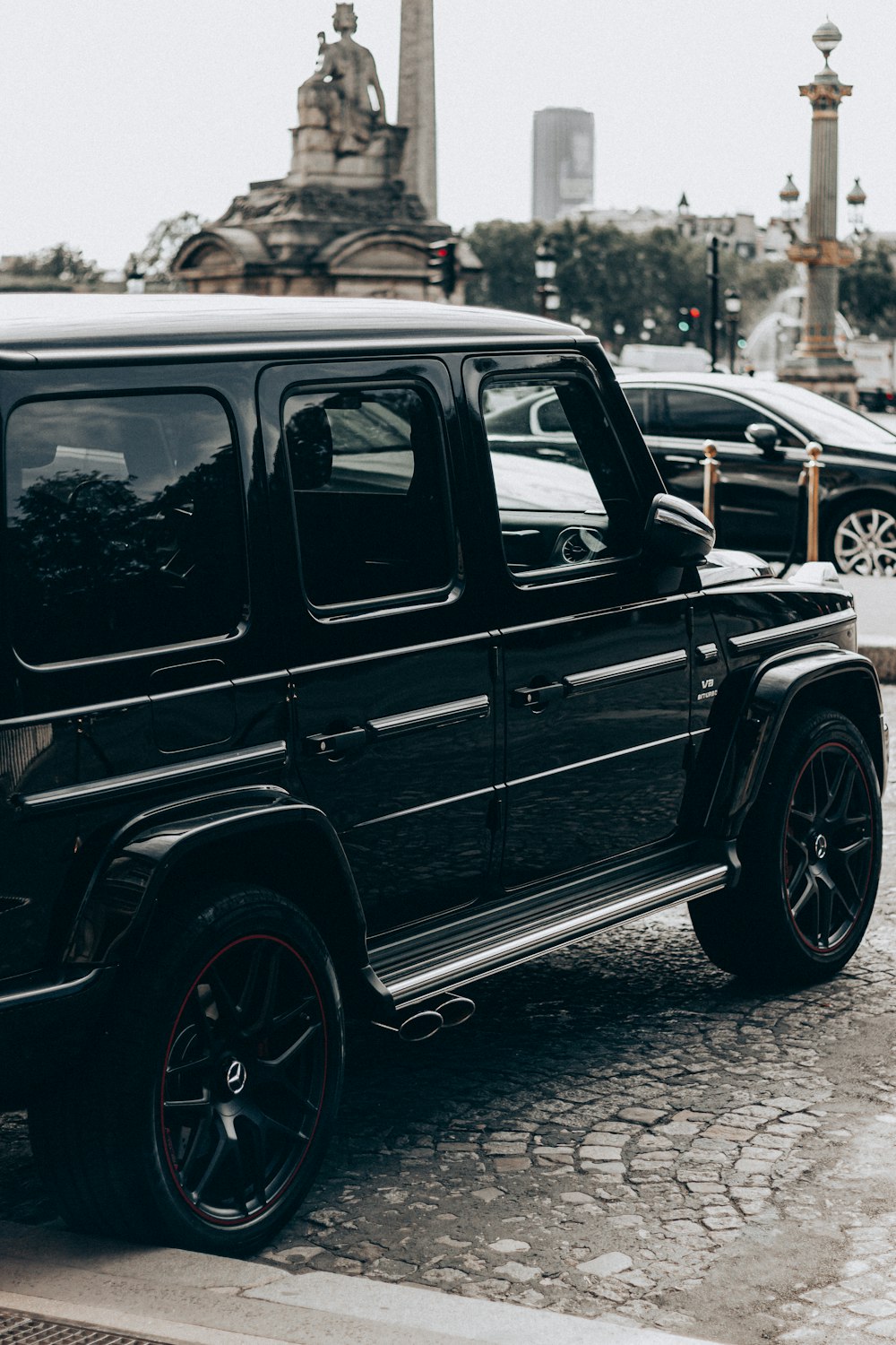 black suv on road during daytime