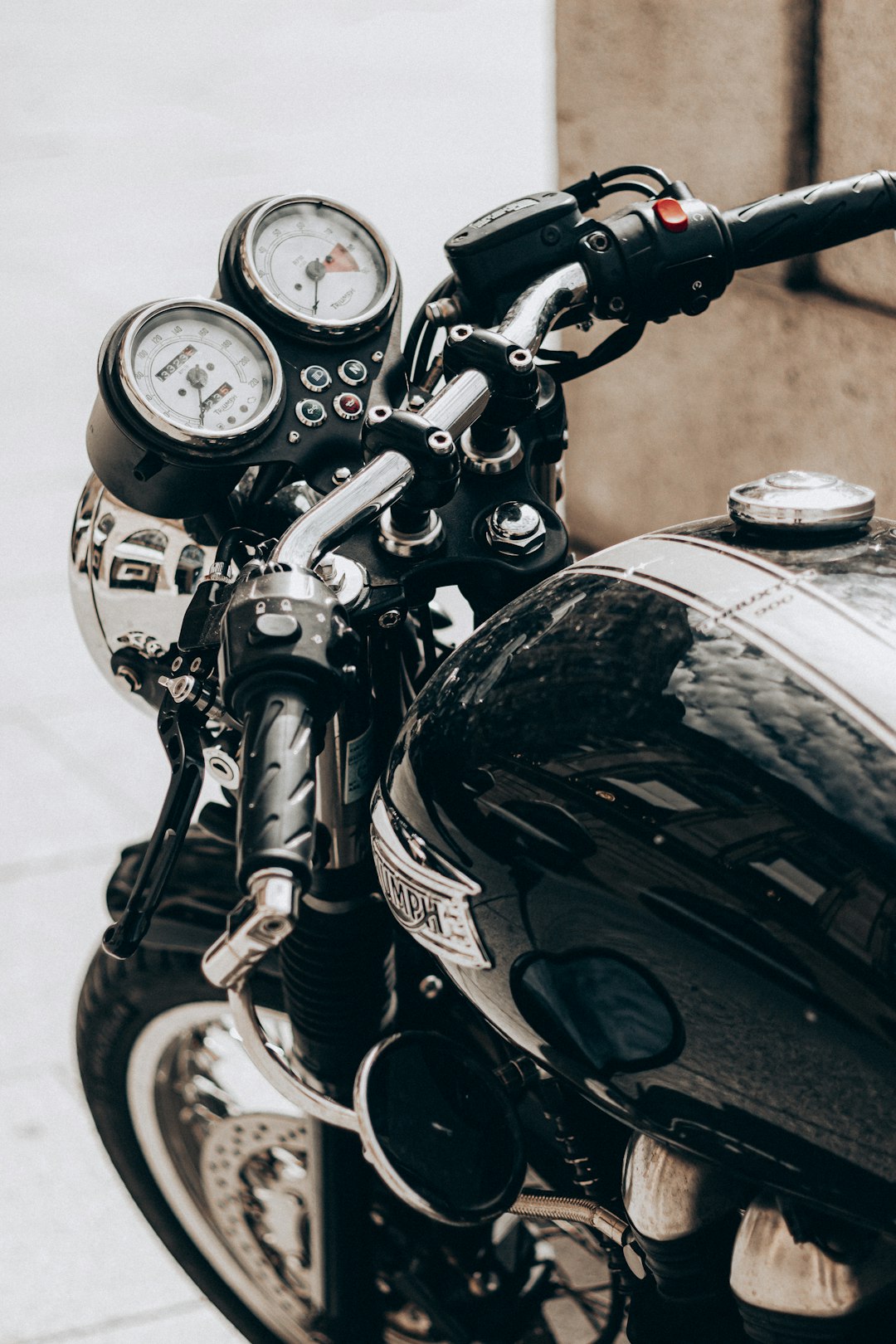 black and silver motorcycle with white and black gauge