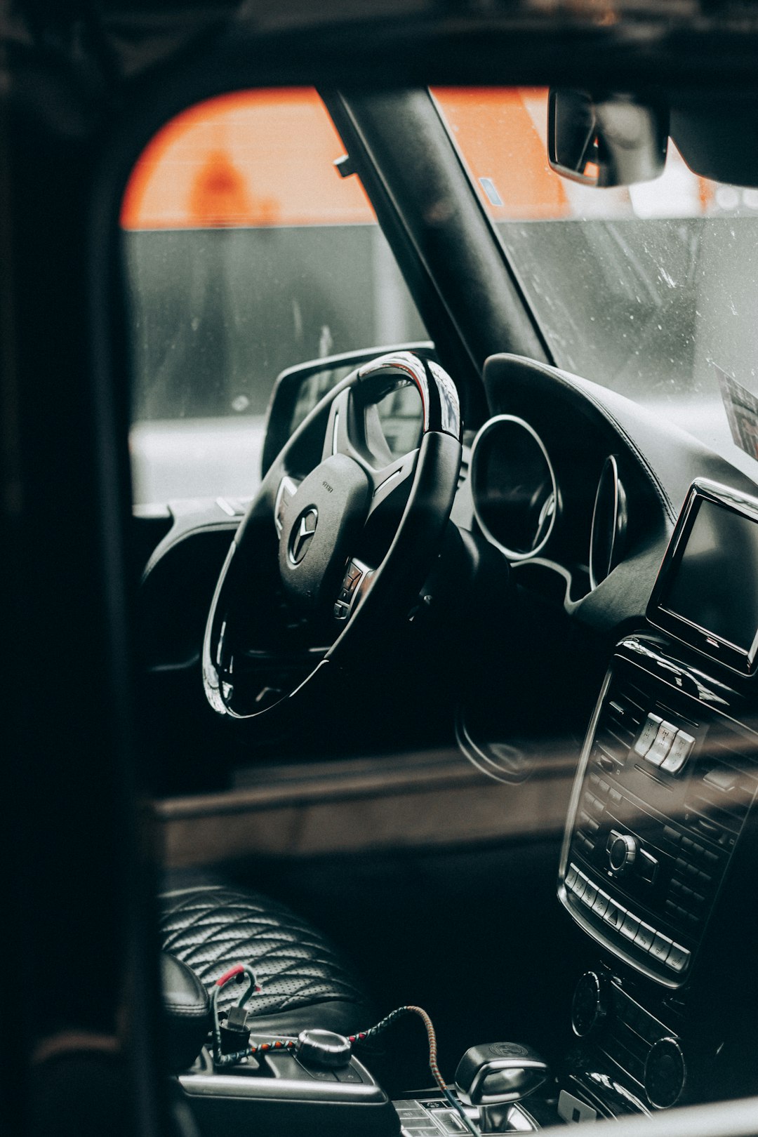 black car steering wheel during night time