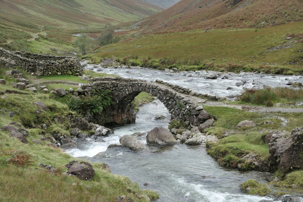 gray concrete bridge over river