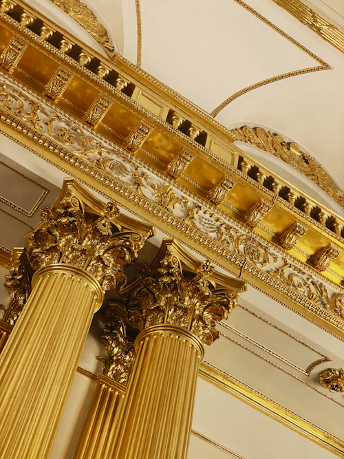 Elegant gold-toned home accessories including vases and candleholders