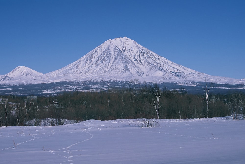 snow covered mountain under blue sky during daytime