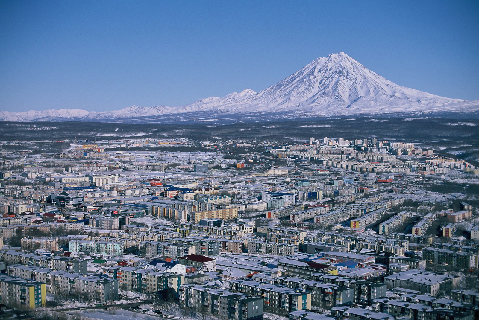 Petropavlovsk-Kamchatsky under the snow-covered cone of Koryaksky volcano