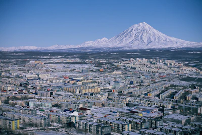 Petropavlovsk-Kamchatsky under the snow-covered cone of Koryaksky volcano