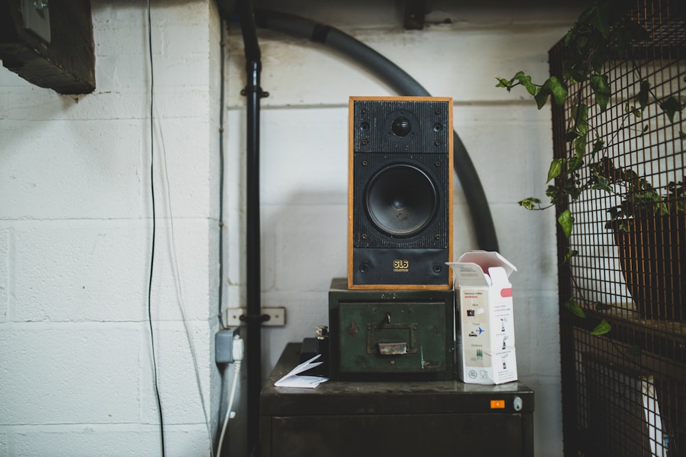 black and brown speaker on black table