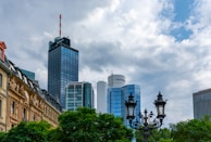 Close-up of energy certificate document with Lübeck cityscape in the background.