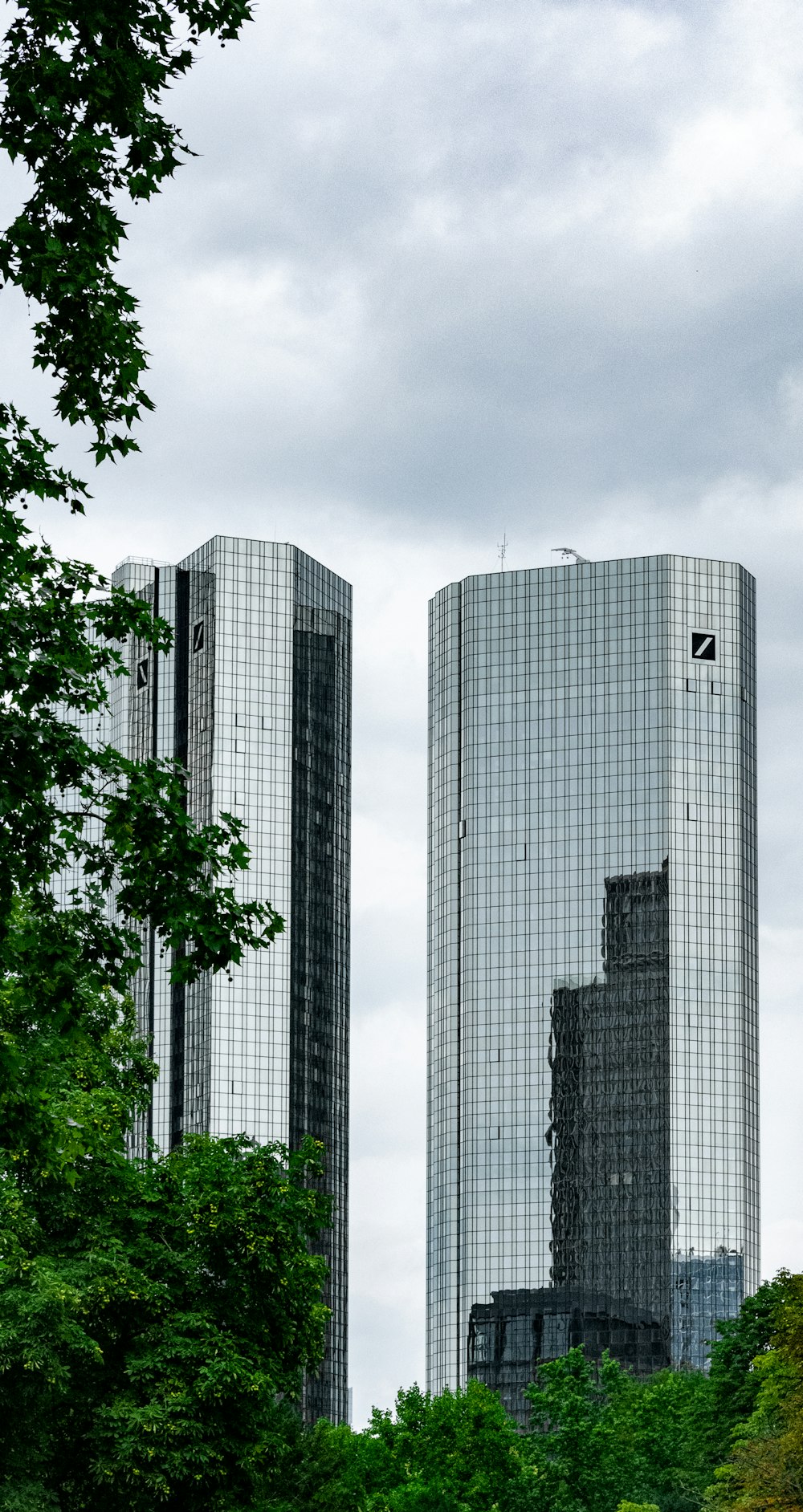 white concrete building near green trees during daytime