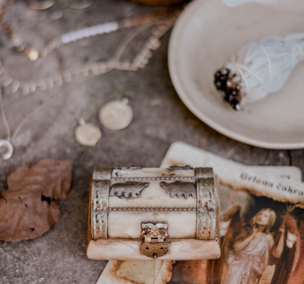 silver ring on brown wooden box