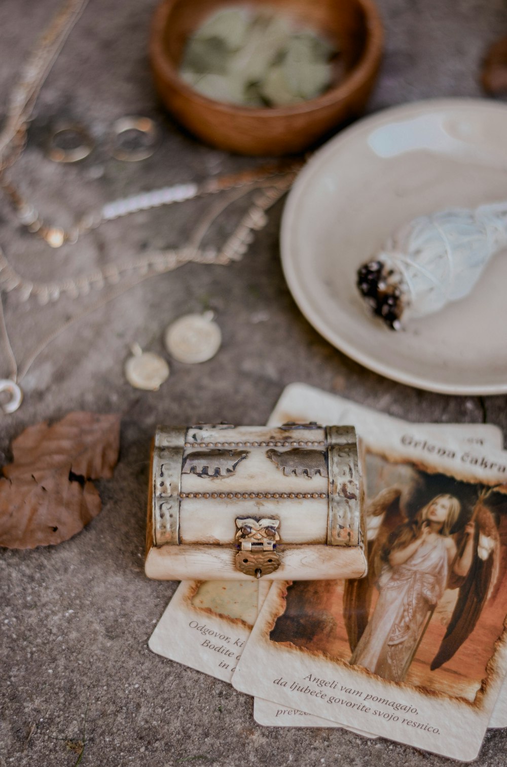 silver ring on brown wooden box