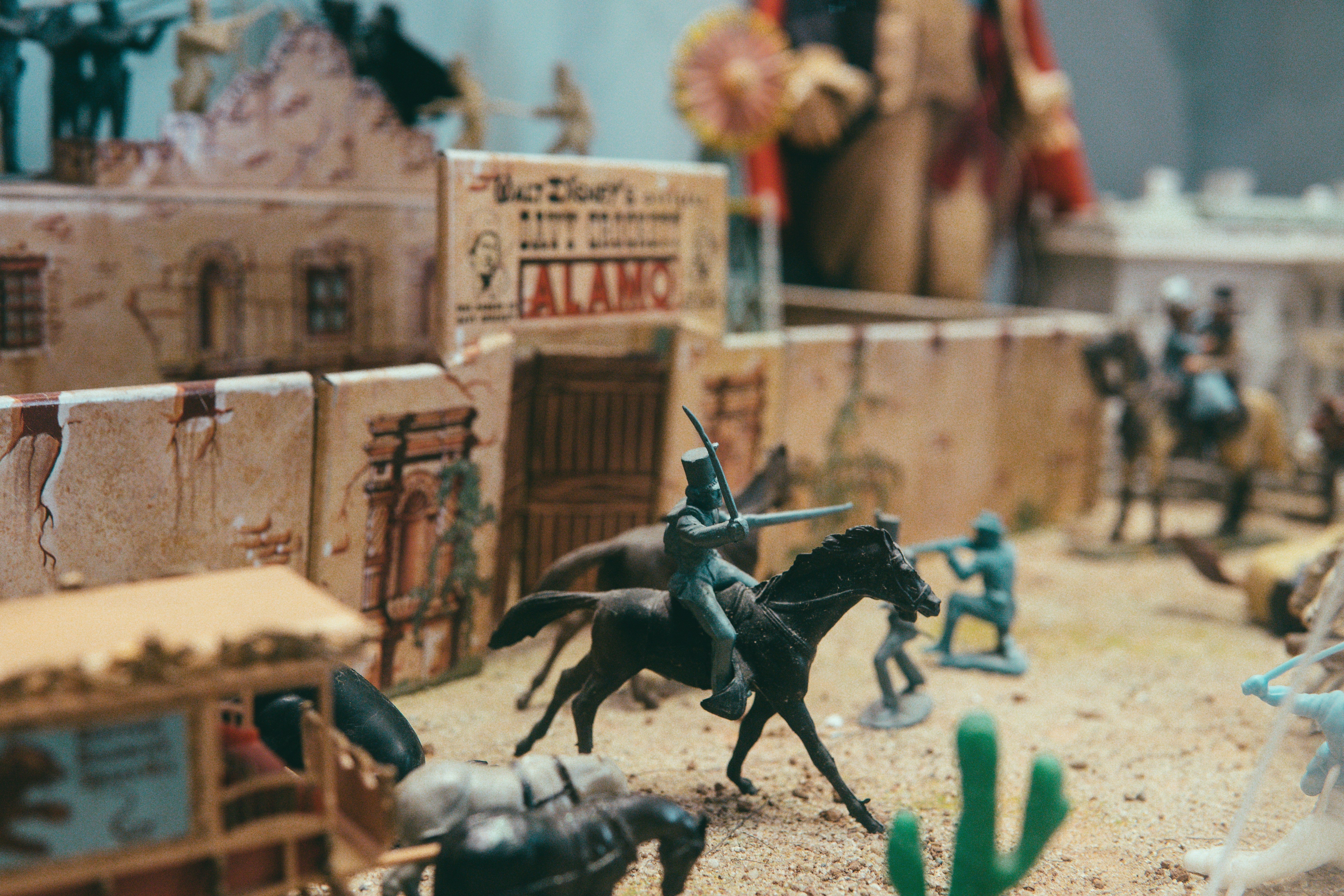 black horse figurine on brown wooden table