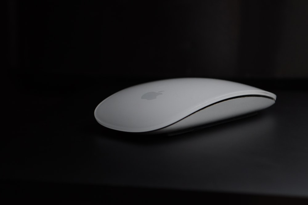 apple magic mouse on black surface